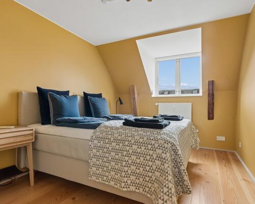 Eksklusiv møbleret penthouse med privat tagterrasse og panoramaudsigt over København til udlejning for 6-12 mdr.