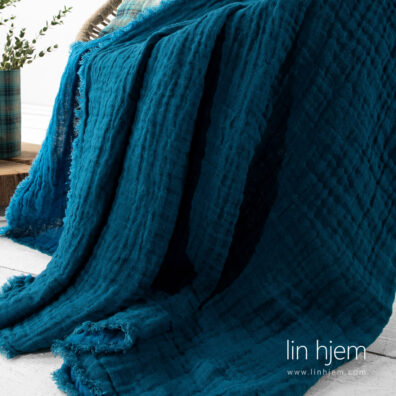 Tosidig pledd i lin, blå farge.