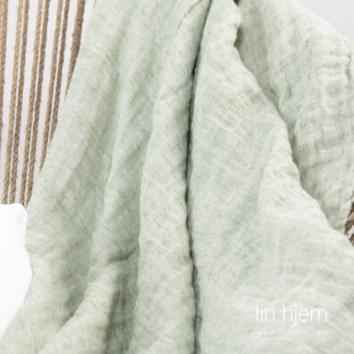 Linpledd i lys grønn farge, tosidig.