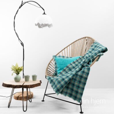 Pledd i lin med grønne ruter.