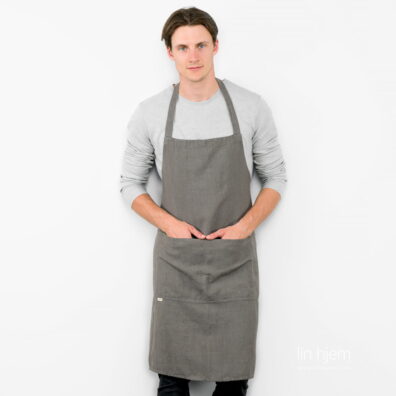 Mønstret linforkle i mørk grå farge.