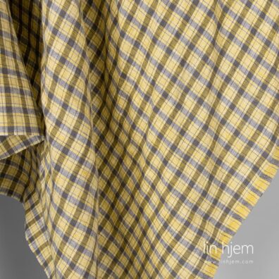 Linstoff i gul og brun, vasket stoff.