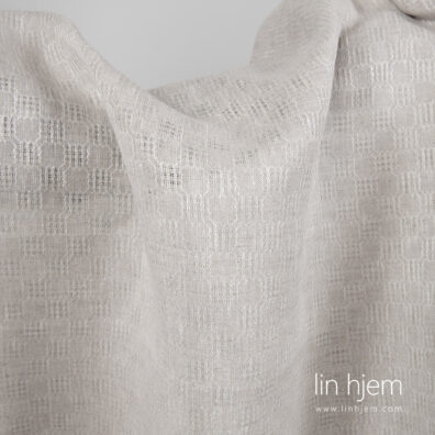 Mønstret linstoff i lys grå farge.