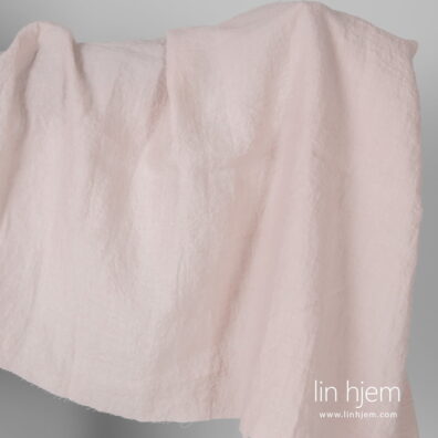 Bredt vasket rosa linstoff.