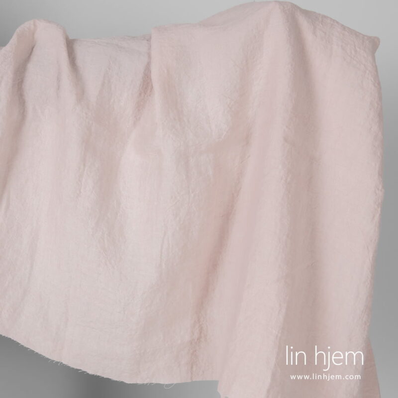 Bredt vasket rosa linstoff.