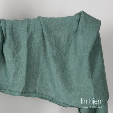 Bredt vasket grønt linstoff.