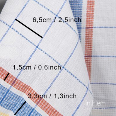 Hvitt rutete stoff i halvlin.