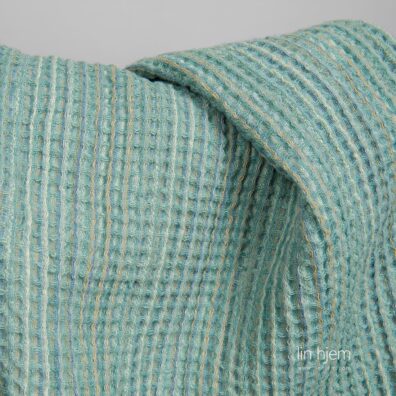 Vasket halvlin grønt stoff.