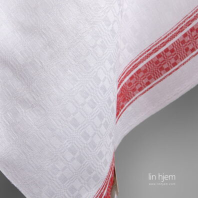Hvitt stoff i halvlin med røde striper.