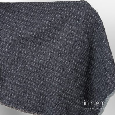 Vasket mønstret svart/grått linstoff.