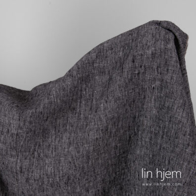 Vasket svart/hvitt melange linstoff.