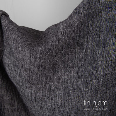 Svart/hvitt melange linstoff, vasket.