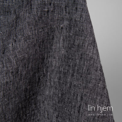 Melange linstoff i svart/hvit.