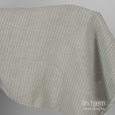 Vasket mønstret halvlin stoff i grå farge.