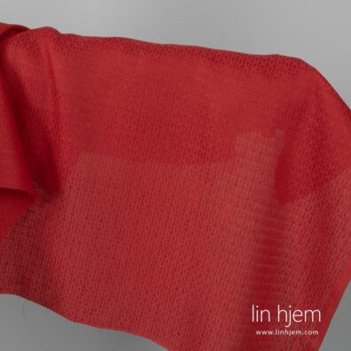 Mønstret rødt lin-bomull stoff.