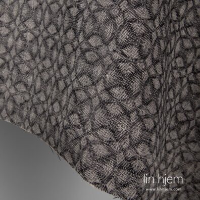 Svart/grått linstoff, mønstret.