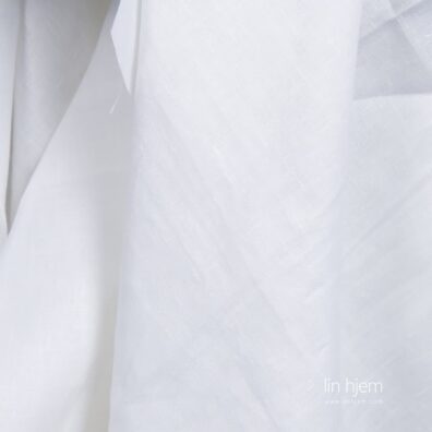 Bredt kritthvitt linstoff.