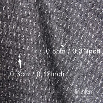 Mønstret vasket linstoff, svart/hvit.