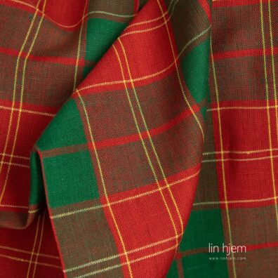 Halvlin stoff med grønne og røde ruter.