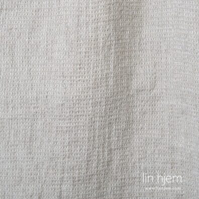 Vasket lysegrått linstoff.