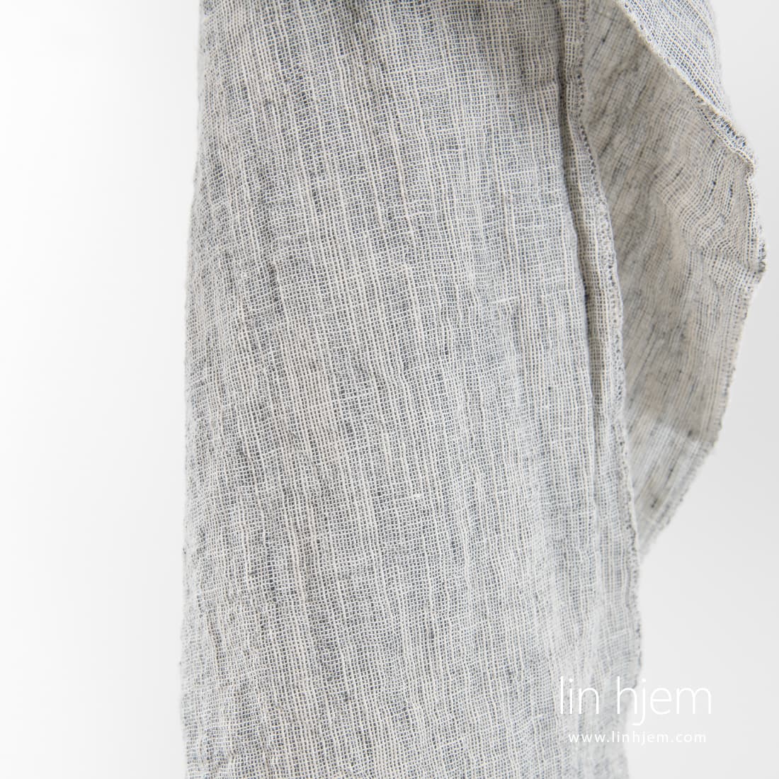 Grå farget bredt vasket halvlin stoff.