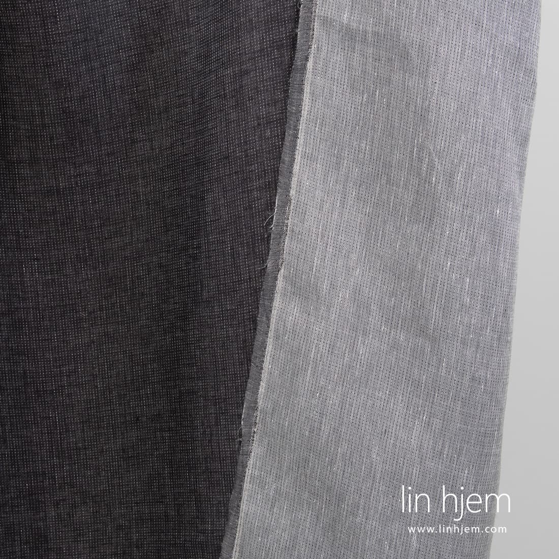 100% linstoff i prikker, svart-grått.