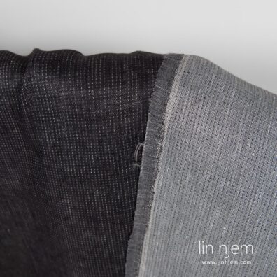 Linstoff i svart grå farge, med prikker.