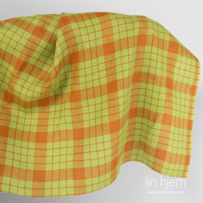 Linstoff i grønne og oransje ruter.