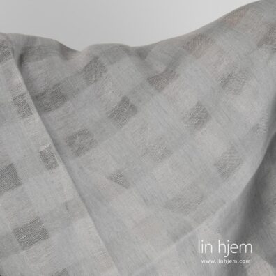 Rutete grått linstoff, gjennomsiktig.