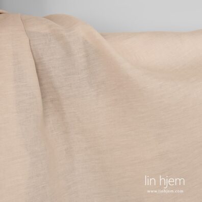 Linstoff av sand farget garn.