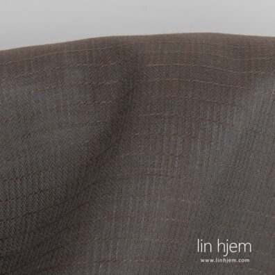 Grått-brunt linstoff, mønstret.