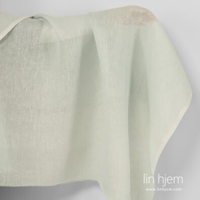 Gjennomsiktig grønnaktig linstoff.