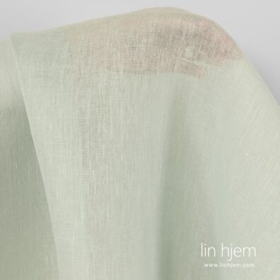 Grønnaktig gjennomsiktig linstoff.