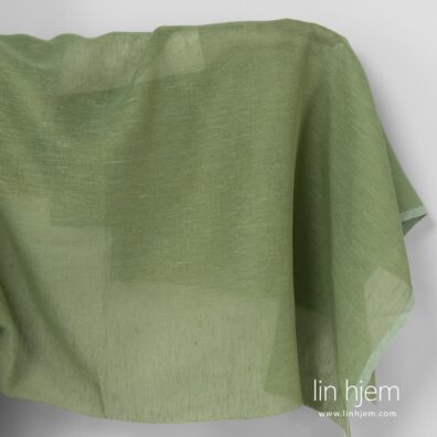 Gjennomsiktig lysegrønt linstoff.