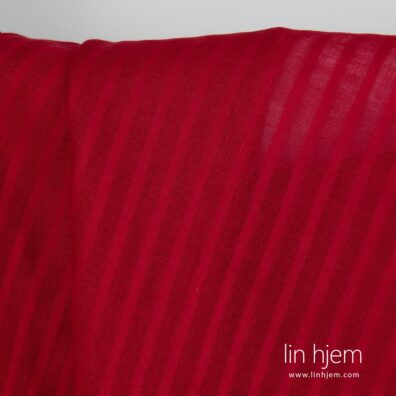 Stripete gjennomsiktig rødt linstoff.