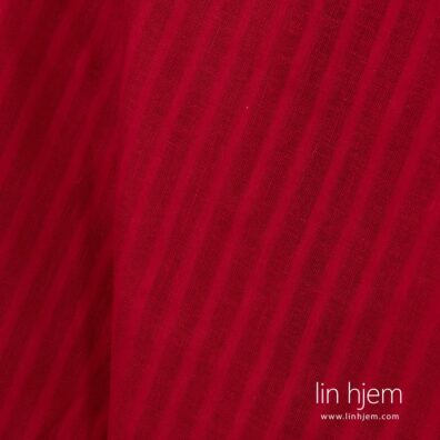 Rødt 100% linstoff i gjennomsiktige striper.