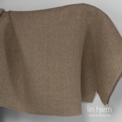 Mønstret gulaktig brunt linstoff.