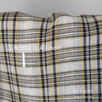 100% linstoff i svarte og gule ruter.