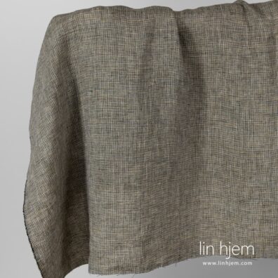 Vasket linstoff med svarte og gule ruter.