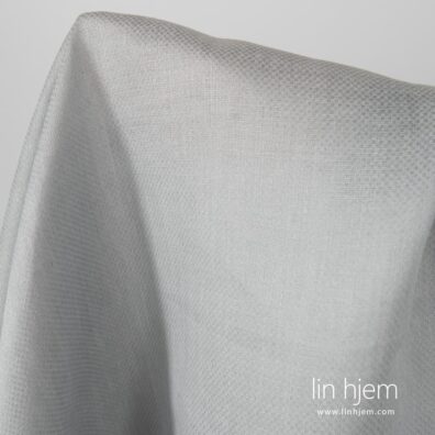 Mønstret 100% linstoff i grå farge.