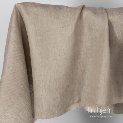 Beige mønstret linstoff.