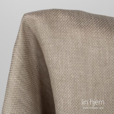 Mønstret beige linstoff.