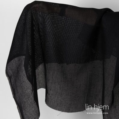 Gjennomsiktig svart linstoff.