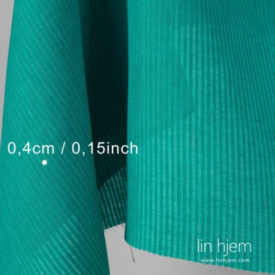 Grønn farget linstoff i striper.