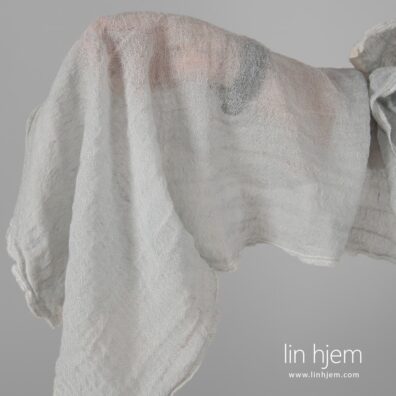 Lin-ull vasket blåaktig grønt stoff.