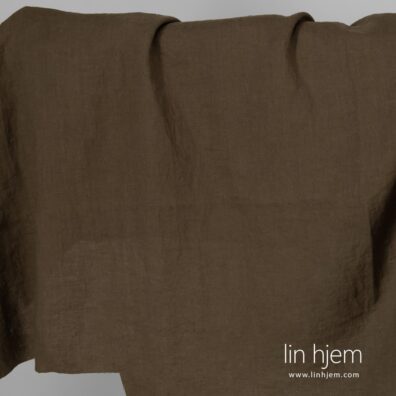 Mørkegrønt vasket linstoff.