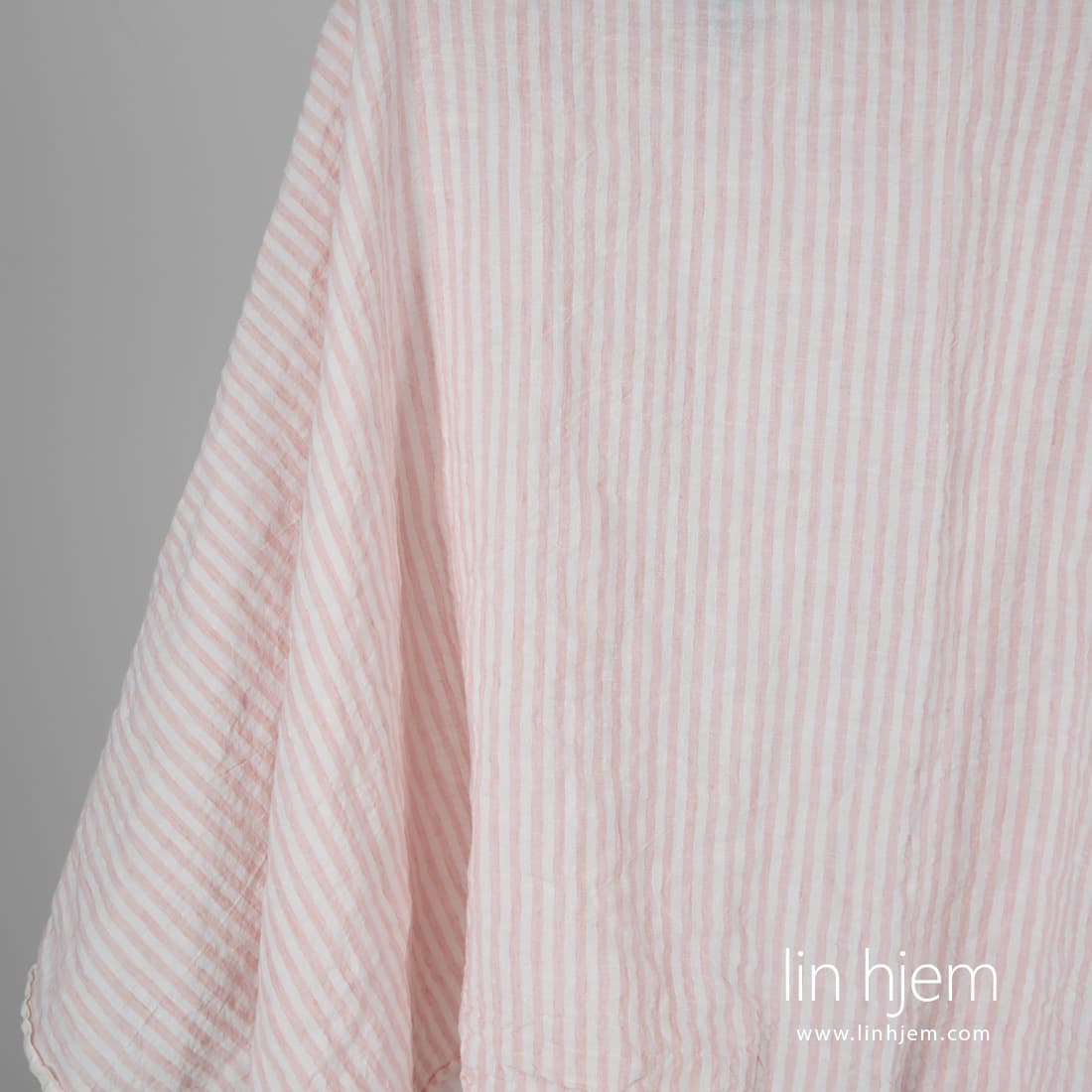 Bredt vasket linstoff i rosa striper.