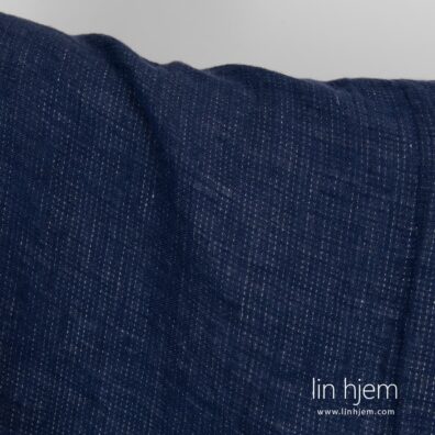 Blått-grått farget linstoff.