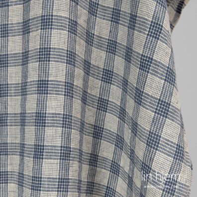 Rutete blått vasket linstoff.