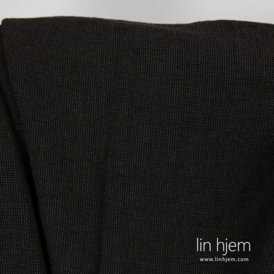 Mønstret vasket halvlin stoff i svart.